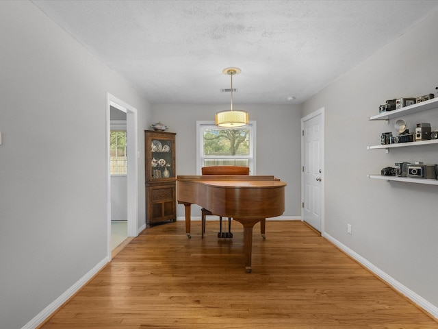 110 Marshall St, League City, TX 77573 - dining area featuring light wood finished floors and baseboards