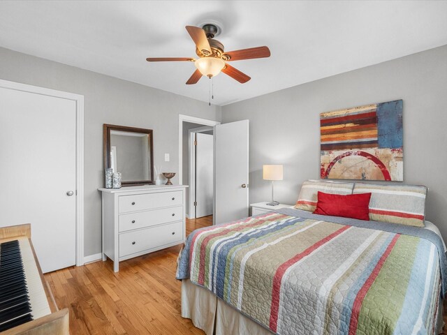 110 Marshall St, League City, TX 77573 - bedroom featuring light wood-type flooring, ceiling fan, and baseboards