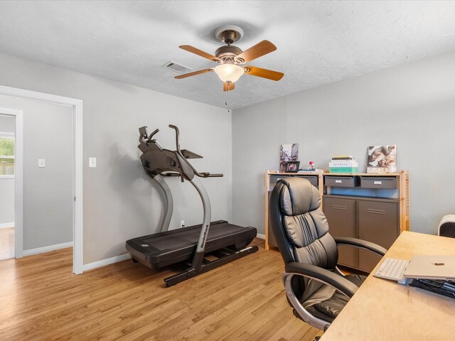 110 Marshall St, League City, TX 77573 - office with light wood finished floors, a ceiling fan, and baseboards