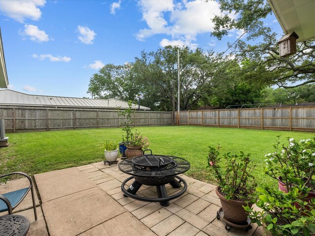 110 Marshall St, League City, TX 77573 - view of patio / terrace with a fire pit