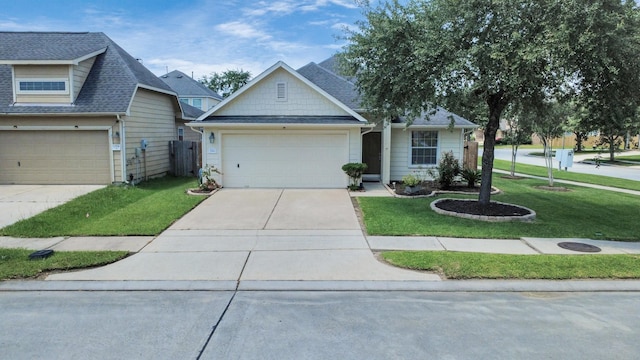 12943 Palm Leaf Ct, Houston, TX 77044 - view of front of property featuring driveway, a front lawn, and an attached garage
