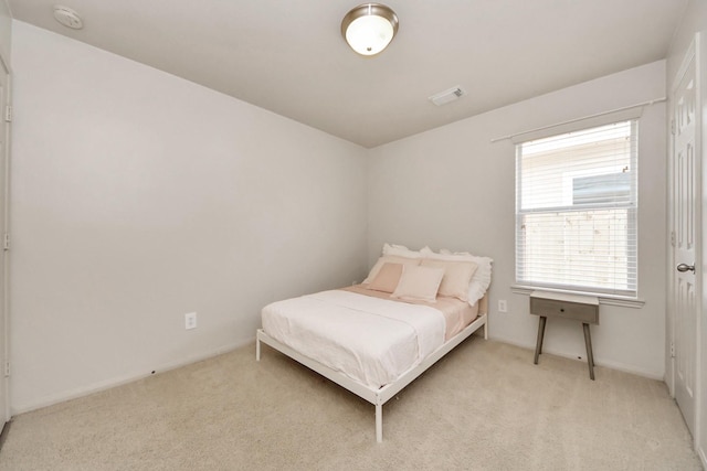 12943 Palm Leaf Ct, Houston, TX 77044 - bedroom with light colored carpet and baseboards