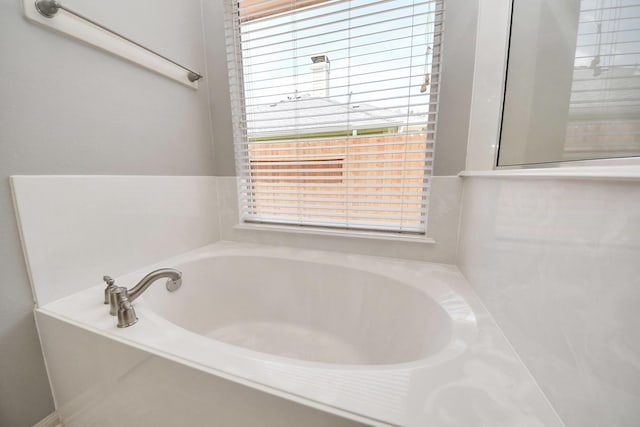 12943 Palm Leaf Ct, Houston, TX 77044 - bathroom with a bath