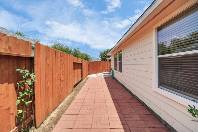 12943 Palm Leaf Ct, Houston, TX 77044 - fenced backyard with a patio area