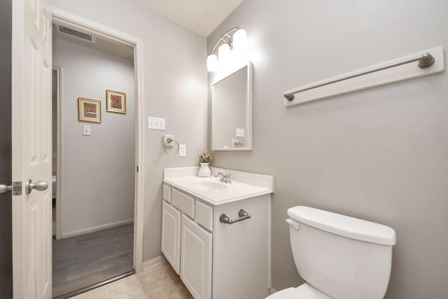 12943 Palm Leaf Ct, Houston, TX 77044 - bathroom with vanity, toilet, and baseboards