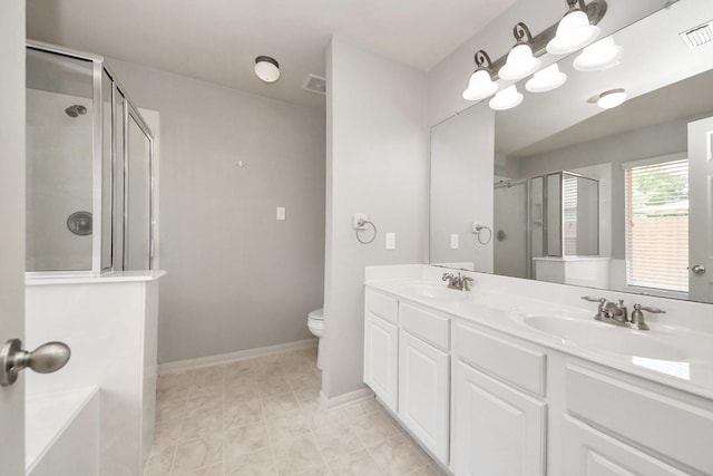 12943 Palm Leaf Ct, Houston, TX 77044 - full bath with an enclosed shower, double vanity, toilet, and baseboards