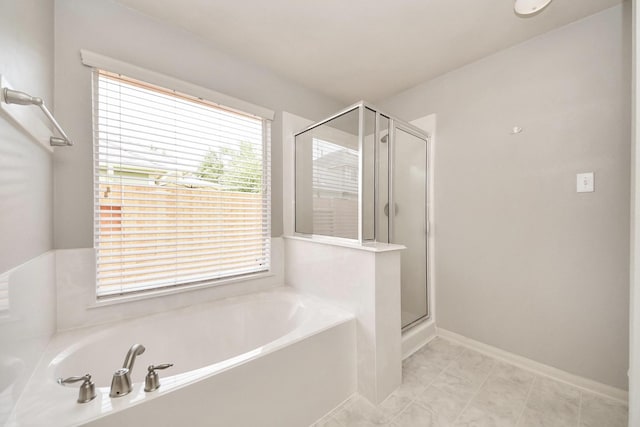 12943 Palm Leaf Ct, Houston, TX 77044 - bathroom with a bath and a shower stall