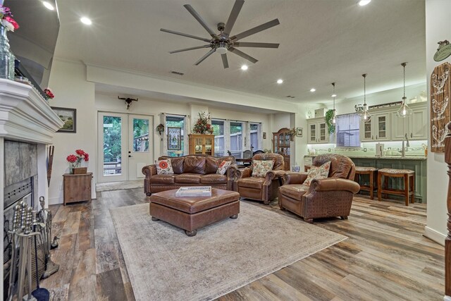 167 Monterrey Rd E, Montgomery, TX 77356 - living room featuring recessed lighting, a ceiling fan, wood finished floors, ornamental molding, and french doors