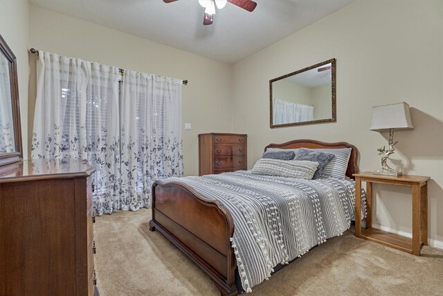 167 Monterrey Rd E, Montgomery, TX 77356 - carpeted bedroom featuring baseboards and ceiling fan