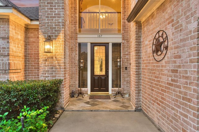 167 Monterrey Rd E, Montgomery, TX 77356 - entrance to property featuring brick siding and roof with shingles