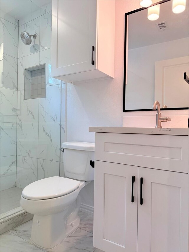 115 Penick Rd, Waller, TX 77484 - full bath featuring marble finish flooring, vanity, toilet, and a marble finish shower