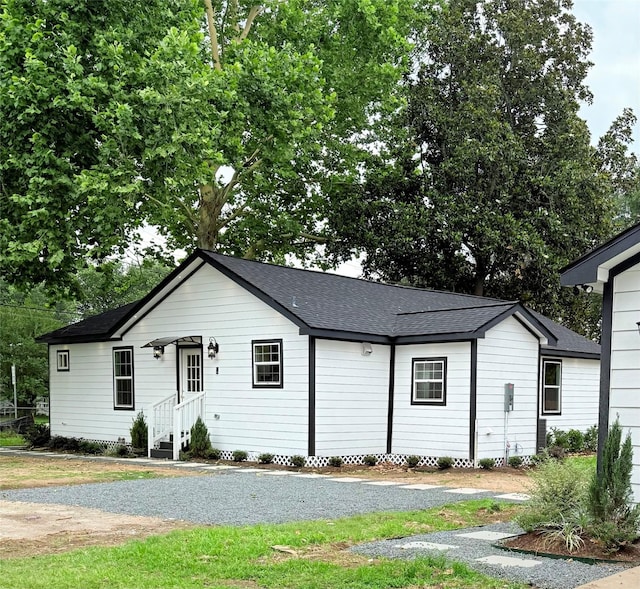 115 Penick Rd, Waller, TX 77484 - view of front of home with a shingled roof and entry steps
