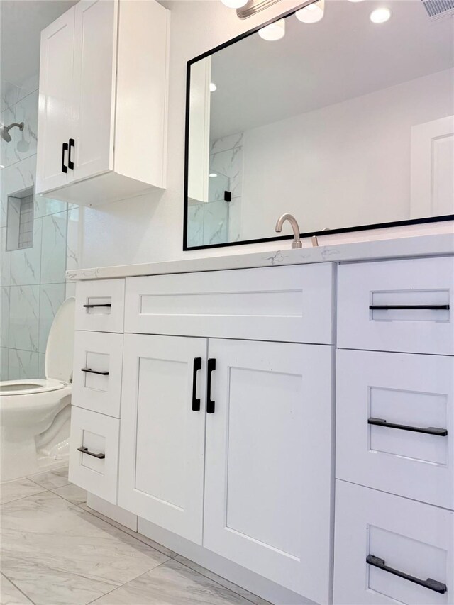 115 Penick Rd, Waller, TX 77484 - full bath featuring marble finish floors, a marble finish shower, toilet, vanity, and recessed lighting