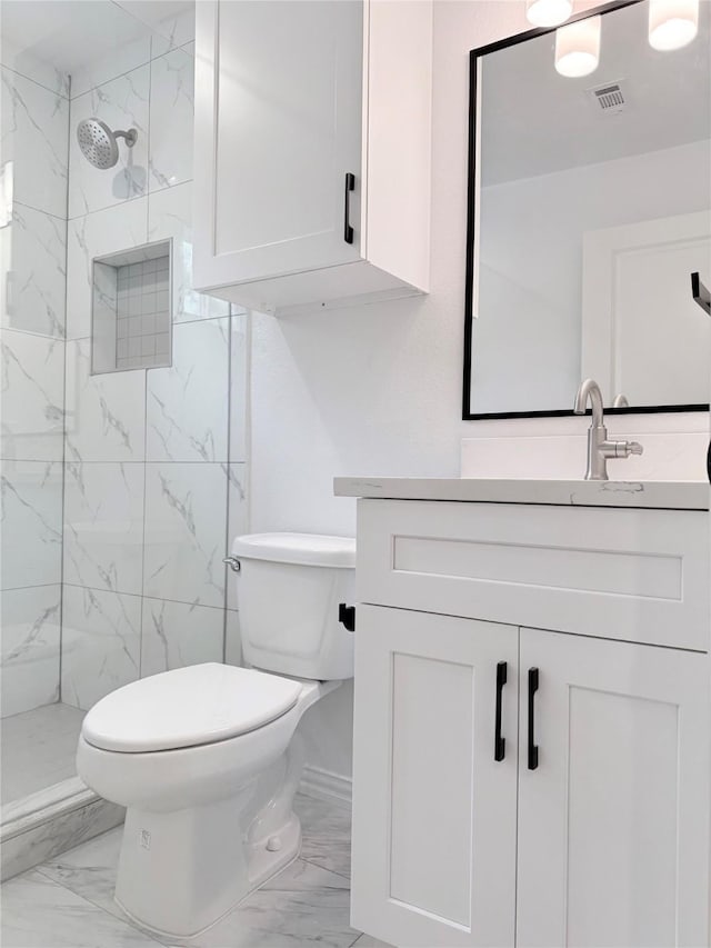 115 Penick Rd, Waller, TX 77484 - full bathroom with marble finish flooring, vanity, toilet, and a marble finish shower