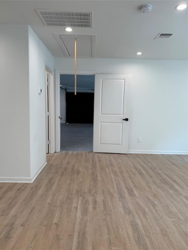 115 Penick Rd, Waller, TX 77484 - empty room featuring attic access, a smoke detector, wood finished floors, baseboards, and recessed lighting