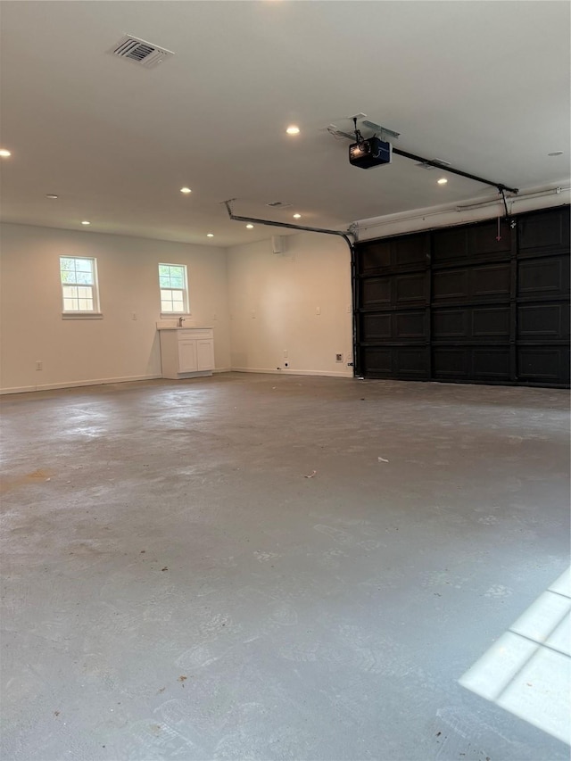 115 Penick Rd, Waller, TX 77484 - garage with a garage door opener, recessed lighting, and baseboards