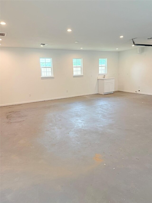 115 Penick Rd, Waller, TX 77484 - below grade area featuring recessed lighting, baseboards, and a sink