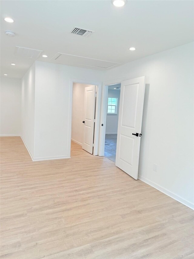 115 Penick Rd, Waller, TX 77484 - empty room with attic access, light wood-style floors, baseboards, and recessed lighting