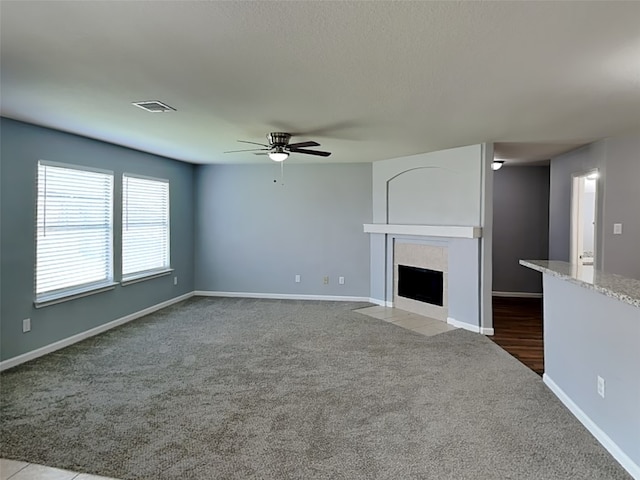422 Magnolia Way, League City, TX 77573 - unfurnished living room featuring ceiling fan, carpet floors, a fireplace, and baseboards