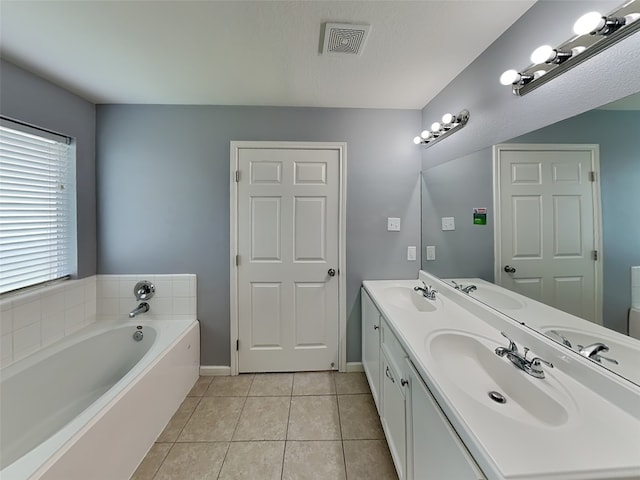 422 Magnolia Way, League City, TX 77573 - full bath featuring double vanity, a garden tub, tile patterned floors, and baseboards