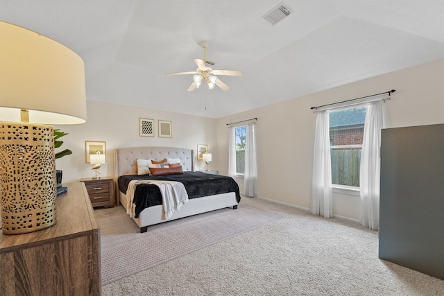 6981 Leisure Ln, Willis, TX 77318 - bedroom with light colored carpet, ceiling fan, and vaulted ceiling
