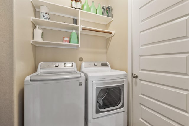 25611 Kearsley Dr, Katy, TX 77494 - washroom with washing machine and clothes dryer
