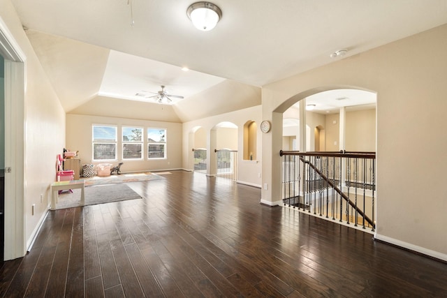 25611 Kearsley Dr, Katy, TX 77494 - living room with a ceiling fan, arched walkways, baseboards, wood finished floors, and lofted ceiling