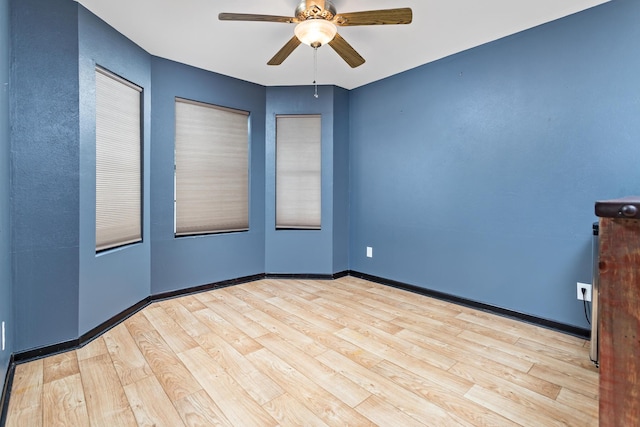 11161 Blue Bonnet Ln, Beaumont, TX 77705 - empty room featuring wood finished floors, a ceiling fan, and baseboards