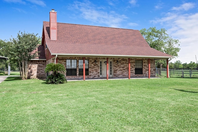 11161 Blue Bonnet Ln, Beaumont, TX 77705 - back of house with a chimney, brick siding, and a shingled roof