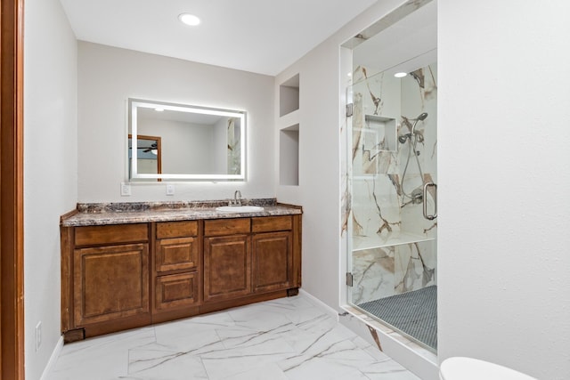 11161 Blue Bonnet Ln, Beaumont, TX 77705 - bathroom featuring a marble finish shower, vanity, toilet, marble finish floors, and recessed lighting