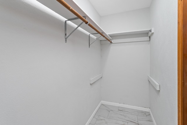 11161 Blue Bonnet Ln, Beaumont, TX 77705 - walk in closet featuring light marble finish flooring