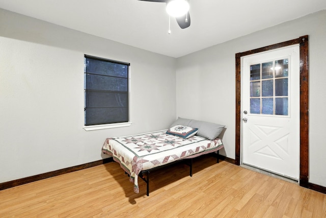 71 White Oak St, Point Blank, TX 77364 - bedroom featuring baseboards, light wood-type flooring, and ceiling fan