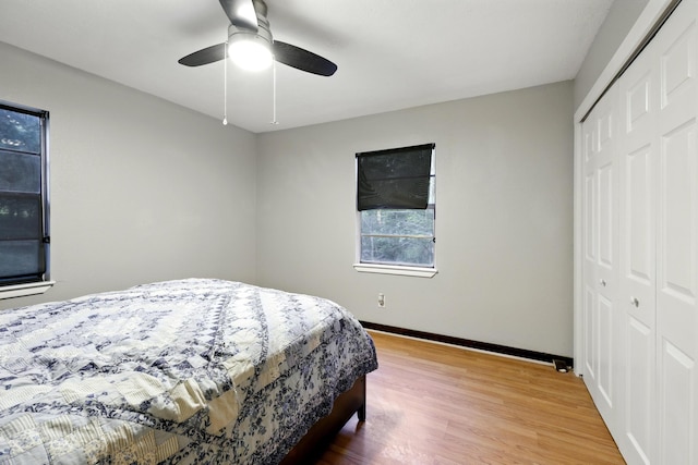 71 White Oak St, Point Blank, TX 77364 - bedroom with a closet, baseboards, wood finished floors, and a ceiling fan