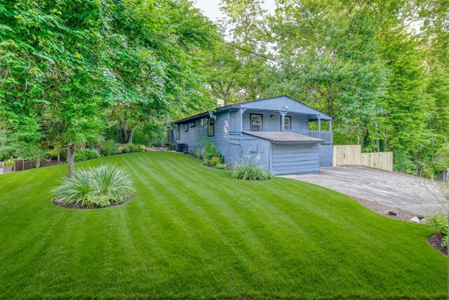 71 White Oak St, Point Blank, TX 77364 - view of yard featuring driveway and central AC unit