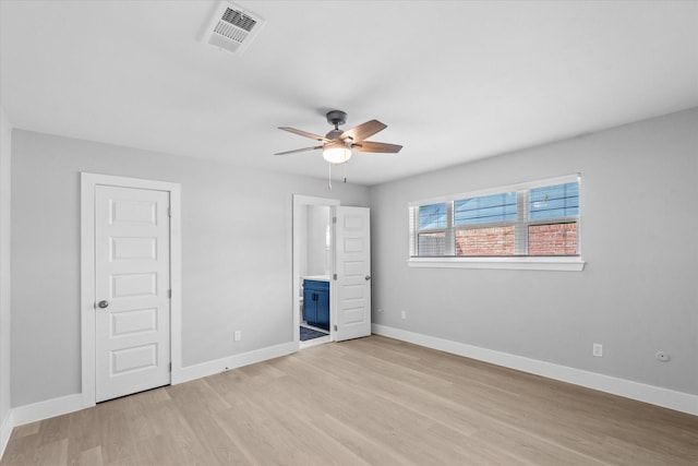 607 Mary Ann Dr, Friendswood, TX 77546 - unfurnished bedroom featuring light wood-style floors, baseboards, ensuite bathroom, and ceiling fan