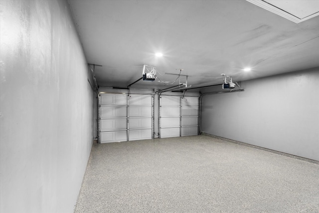 607 Mary Ann Dr, Friendswood, TX 77546 - garage featuring a garage door opener and recessed lighting