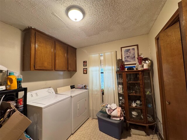 1347 Cardinal Ln, Trinity, TX 75862 - laundry area featuring washer and clothes dryer, cabinet space, and a textured ceiling