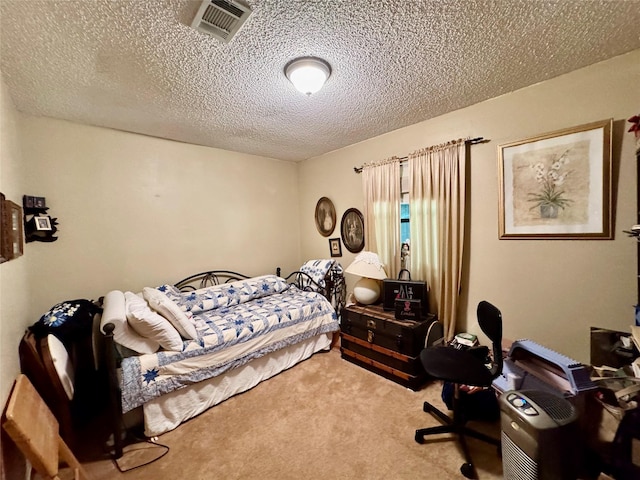 1347 Cardinal Ln, Trinity, TX 75862 - carpeted bedroom with a textured ceiling