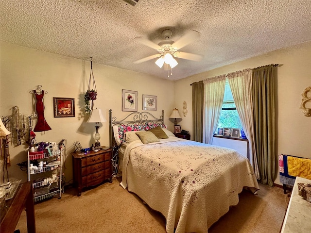 1347 Cardinal Ln, Trinity, TX 75862 - bedroom featuring light colored carpet, a textured ceiling, and ceiling fan