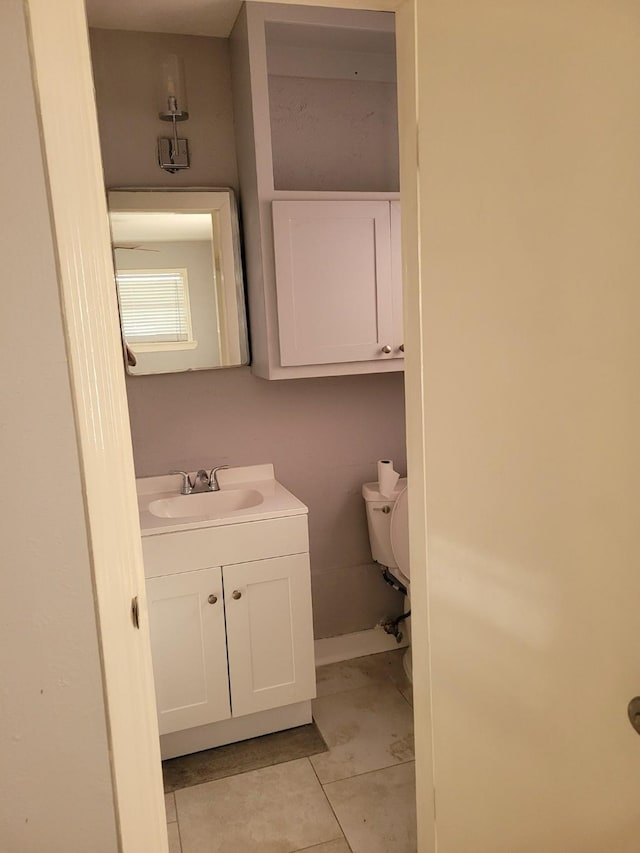 5754 Belarbor St, Houston, TX 77033 - bathroom featuring vanity, toilet, and tile patterned floors