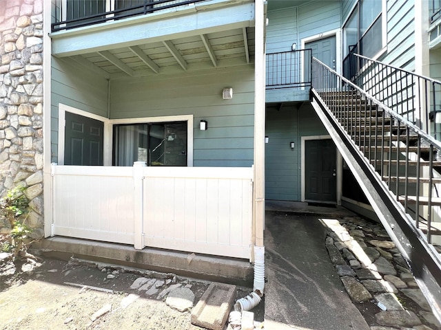 3754 Tanglewilde St Unit 9, Houston, TX 77063 - entrance to property featuring stone siding and a balcony