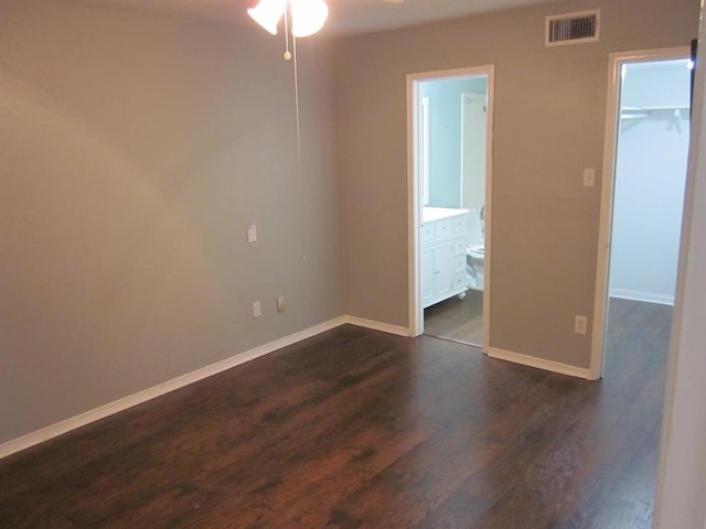 9797 Leawood Blvd Unit 1411, Houston, TX 77099 - unfurnished room with a ceiling fan, dark wood finished floors, and baseboards