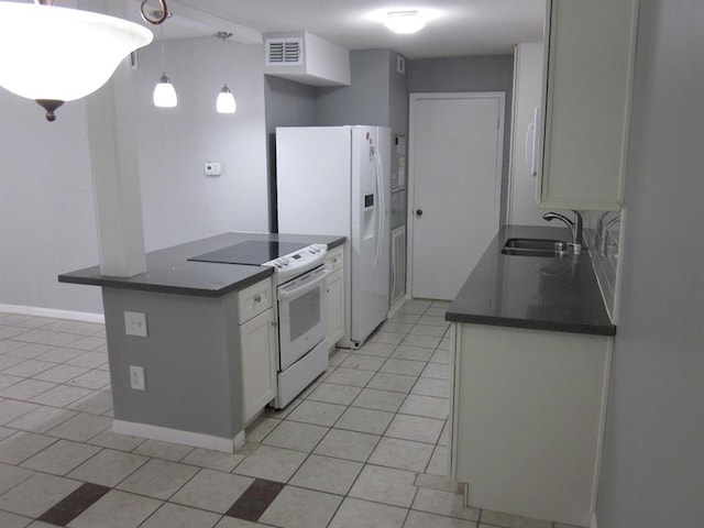 9797 Leawood Blvd Unit 1411, Houston, TX 77099 - kitchen featuring a sink, white appliances, dark countertops, and white cabinets