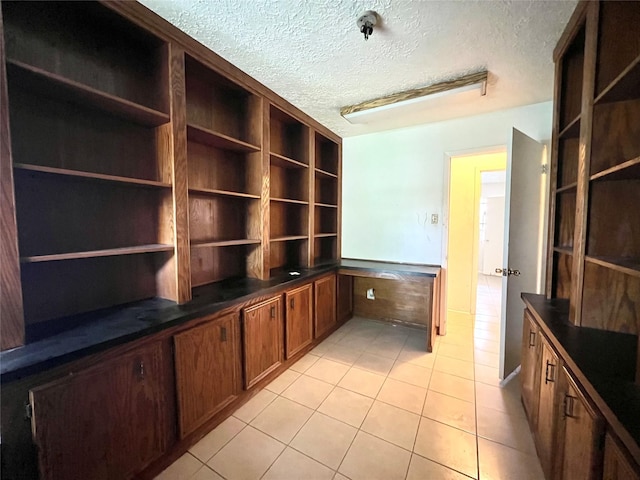 4306 Rosebud Dr, Houston, TX 77053 - unfurnished office featuring light tile patterned floors and a textured ceiling
