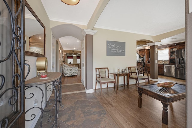 2218 Cherry Ln, Pasadena, TX 77502 - foyer featuring arched walkways, crown molding, baseboards, and decorative columns