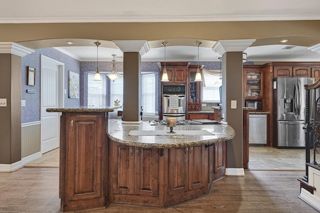 2218 Cherry Ln, Pasadena, TX 77502 - kitchen with stainless steel appliances, light wood finished floors, glass insert cabinets, a center island, and ornamental molding