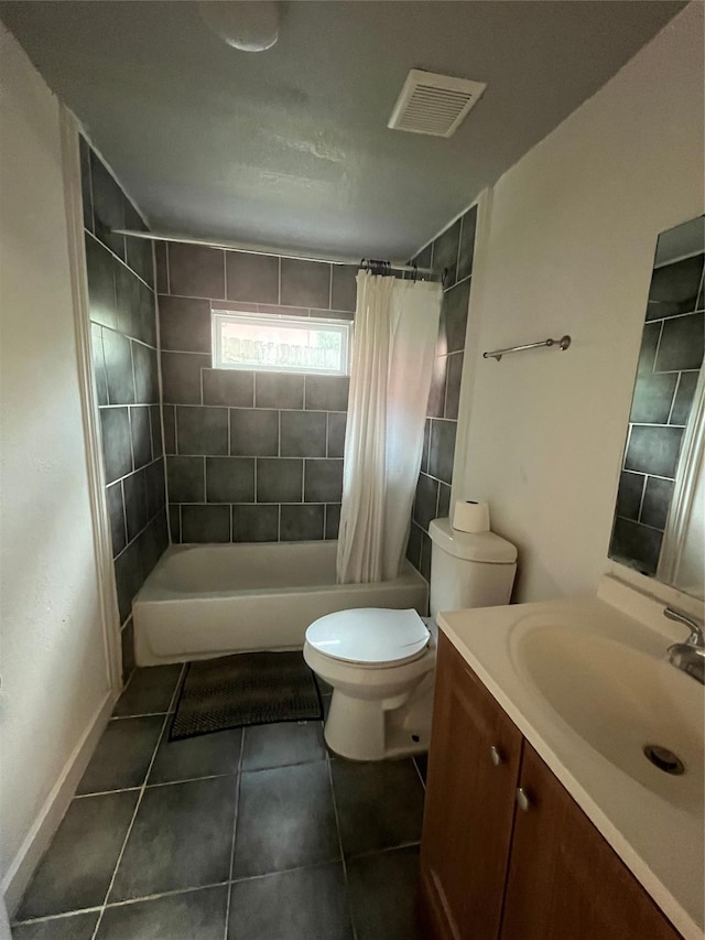 4416 Quitman St, Houston, TX 77026 - full bathroom with vanity, tile patterned flooring, toilet, shower / bath combo with shower curtain, and baseboards