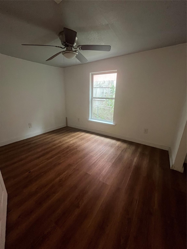 4416 Quitman St, Houston, TX 77026 - spare room with wood finished floors, baseboards, and ceiling fan