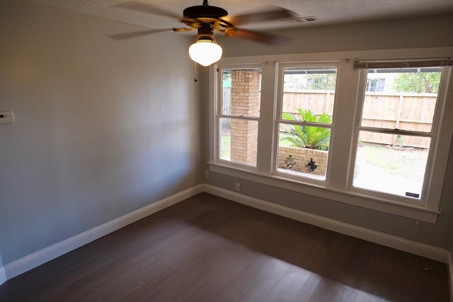 4737 Jefferson St, Houston, TX 77023 - unfurnished room with baseboards, dark wood-style flooring, and healthy amount of natural light