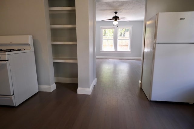 4737 Jefferson St, Houston, TX 77023 - kitchen with white appliances, a ceiling fan, baseboards, dark wood-style flooring, and built in shelves